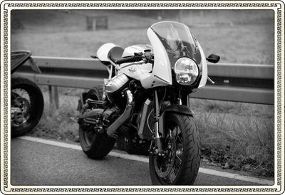 Close-up of motorcycle on road