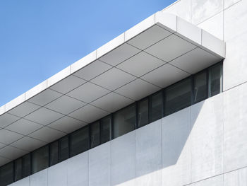 Low angle view of modern building against clear sky