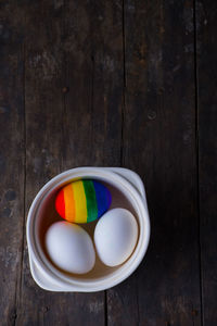 Directly above shot of multi colored candies in bowl on table