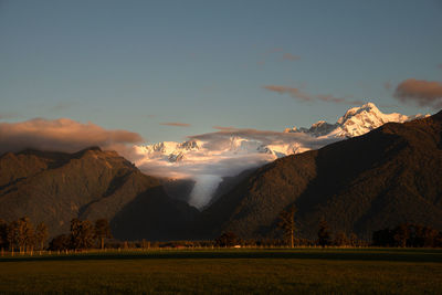 Scenic view of mountains against sky during sunset