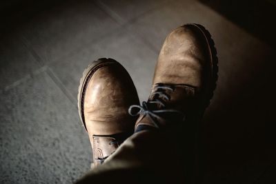 Low section of people standing on tiled floor