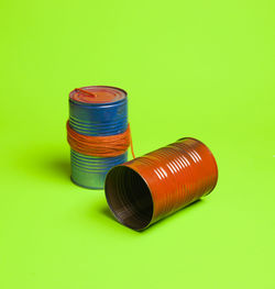 Close-up of multi colored pencils on green background