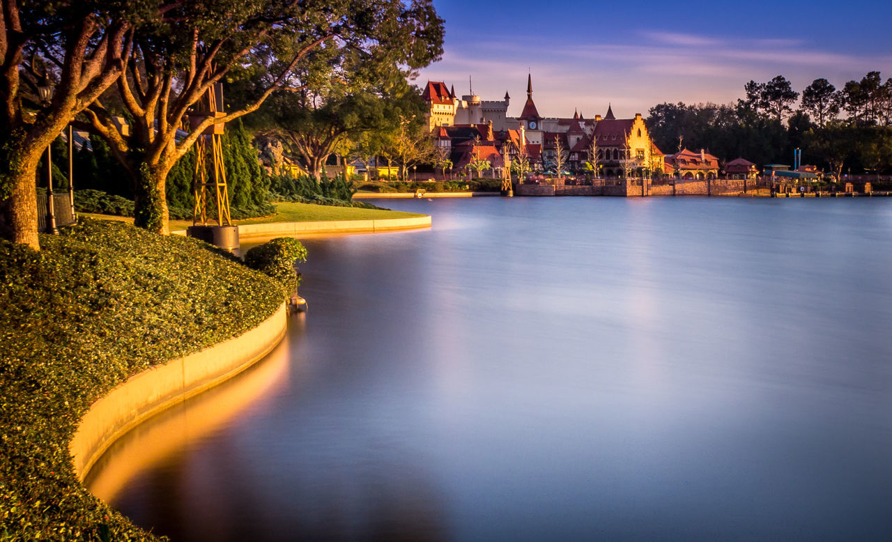 architecture, water, built structure, building exterior, tree, reflection, waterfront, river, sky, no people, outdoors, nature, city, day