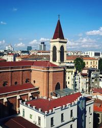 View of buildings in city against sky