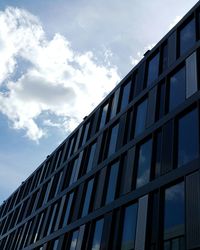 Low angle view of office building against sky
