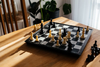 High angle view of chess playing on table at home