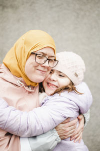 Portrait of a mother with baby girl