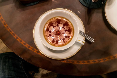 High angle view of coffee in plate on table