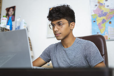 Portrait of young man using mobile phone