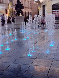 Fountain in city at night