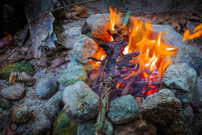 High angle view of fire on rock