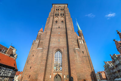 Low angle view of building against blue sky