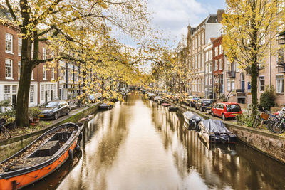 Canal amidst buildings in city