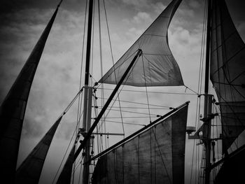 Low angle view of suspension bridge against sky