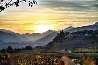 Scenic view of landscape against sky during sunset