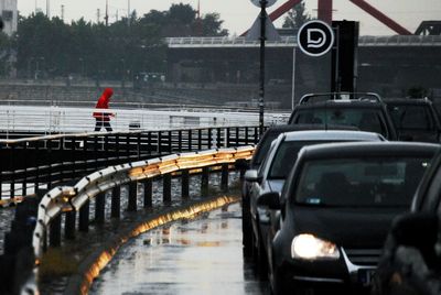 Cars on road in rainy season