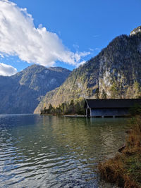 Scenic view of lake and mountains against sky