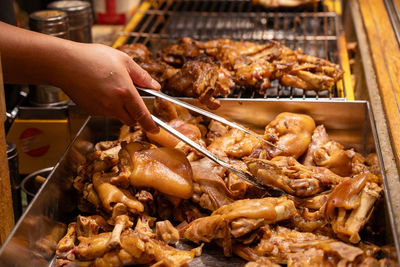 Cropped hand of man preparing food