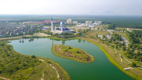 High angle view of river amidst buildings in city