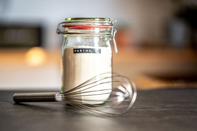 Close-up of drink in glass jar on table