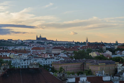 High angle shot of townscape against sky at sunset