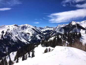 Scenic view of snowcapped mountains against sky