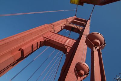 Low angle view of street light against blue sky