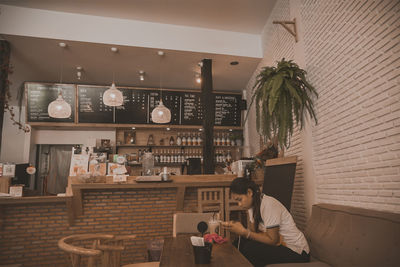 Woman sitting in restaurant