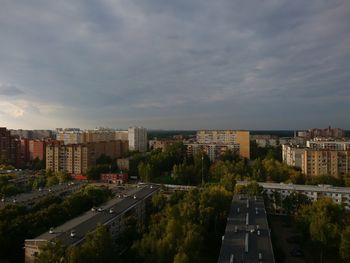 High angle view of buildings in city against sky