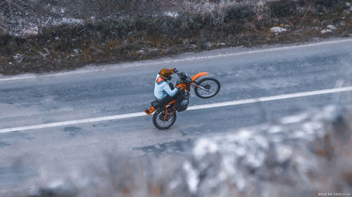 Man riding motorcycle on road