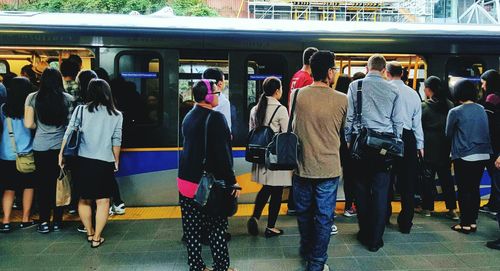 Group of people at railroad station