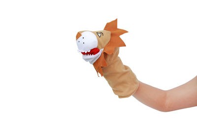 Hand holding toy against white background