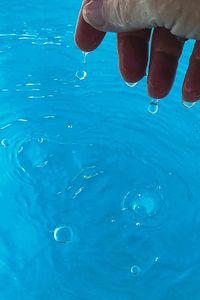 Person hand in water