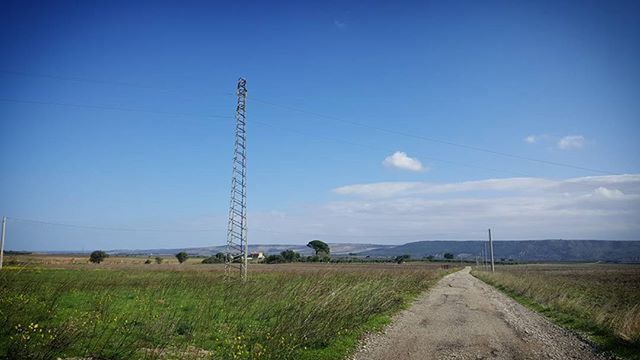 landscape, field, electricity pylon, grass, power line, sky, tranquil scene, tranquility, the way forward, blue, electricity, road, rural scene, fuel and power generation, nature, scenics, country road, power supply, countryside, horizon over land