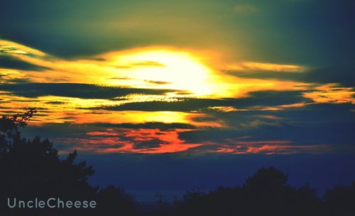 Low angle view of cloudy sky at sunset