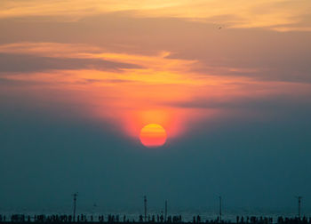 Scenic view of silhouette landscape against romantic sky at sunset