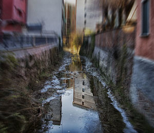 Reflection of wet puddle in rainy season