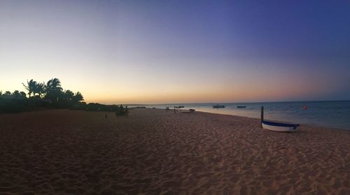 Scenic view of beach against clear sky