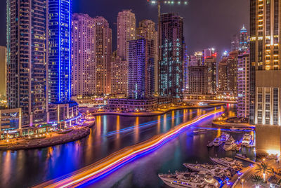 Illuminated buildings in city at night