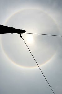 Low angle view of electricity pylon against sky