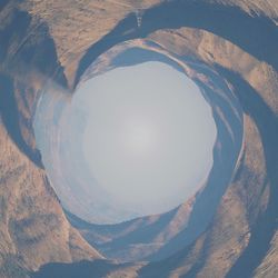 High angle view of snowcapped mountains against sky