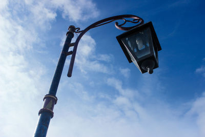 Low angle view of street light against sky