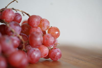 Close-up of grapes on table