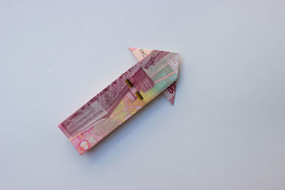 Close-up of paper currency on white background