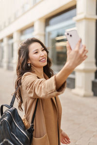 Young woman using mobile phone