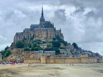 View of historic building against cloudy sky