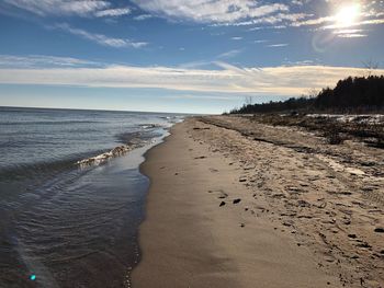 Scenic view of beach against sky during sunset