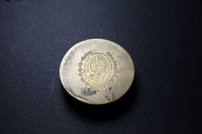 Close-up of coins on table