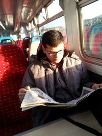 High angle view of man sitting in train