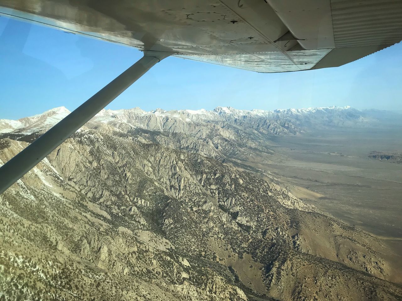 SCENIC VIEW OF LANDSCAPE AGAINST SKY SEEN FROM AIRPLANE